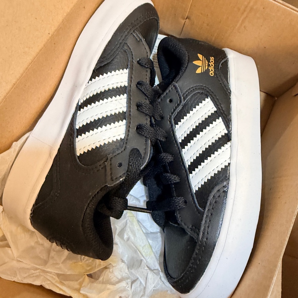 Adidas Kids Black and White Sneakers with Gold Accents